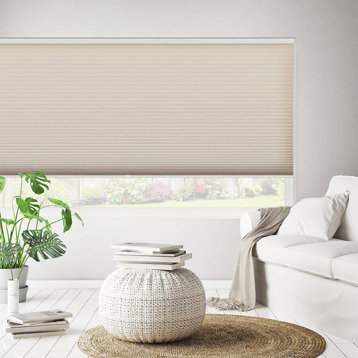 Light filtering cellular shade featuring color alabaster