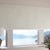 Thumbnail - The Motorized Blackout Roller Shades in the Catania Off-White color with the Fabric Wrapped 4in. Cornice.