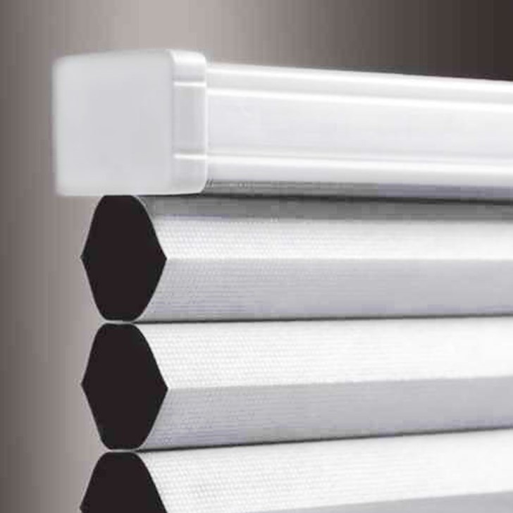 Close up headrail view of blackout cellular shade shown in Shadow White