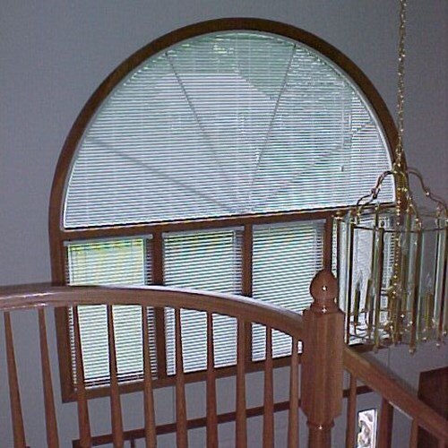 The Bali 1 Inch Arch Mini Blinds come with color-coordinated components to provide a finished look.