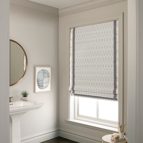 The Premium Roman Shades in the Pinnacles Biscuit color with the Classic Fold, Blackout Liner, and Inset Binding Tape in the Pebble color.