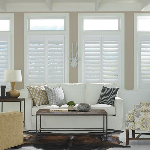 The Woodcore Faux Wood Shutters shown in the color white.
