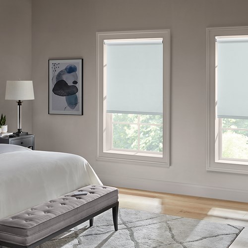 Motorized Blackout Roller Shades in the Paramount Ice color.