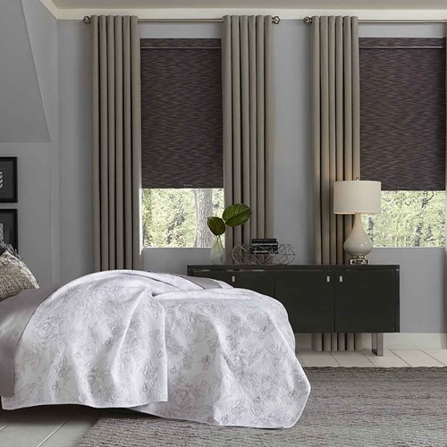 Blackout roller shade paired with the easy grommet drapery. Shade Color: Cascade Blackout Graphite 36005; Drapery Color: Rio Stone