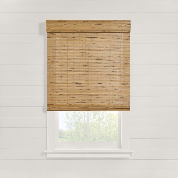Motorized Woven Wood Shades in the Malibu Caramel color and Outside Mount.