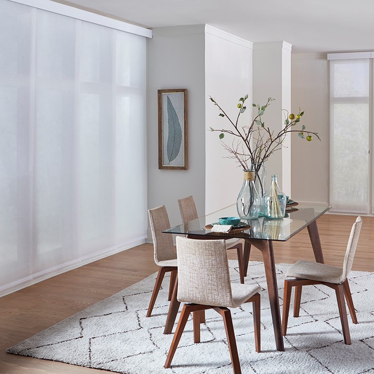 The fabric sliding panel paired with a solar roller shade. Color: Flaxen 11% Pure White