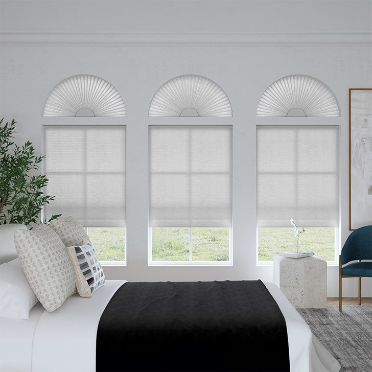 Light Filtering Arch and Light Filtering Cellular Shades in the Gray Sheen color.