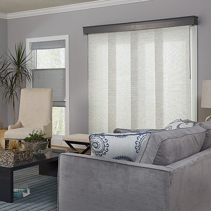 Super value sliding panels paired with the wood cornice and the woven wood shade. Panel Color: Mimosa Cotton 3722; Cornice: Davenport Cement 6018; Woven Color: Hana Platinum D07