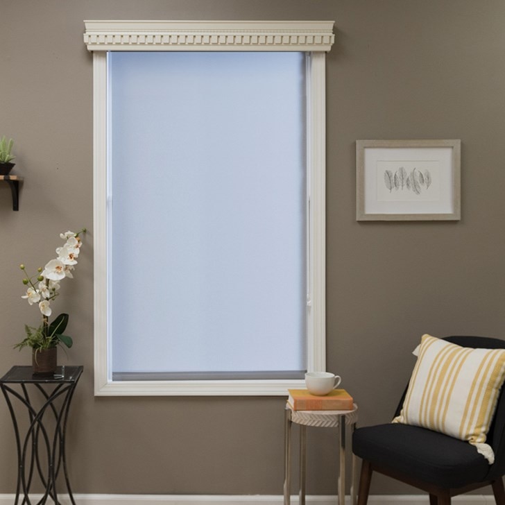 Blinds.com Dentil Wood Cornice in Davenport Cotton 6011 paired with Blinds.com Signature Light Filtering Roller Shade in Carousal Steel.