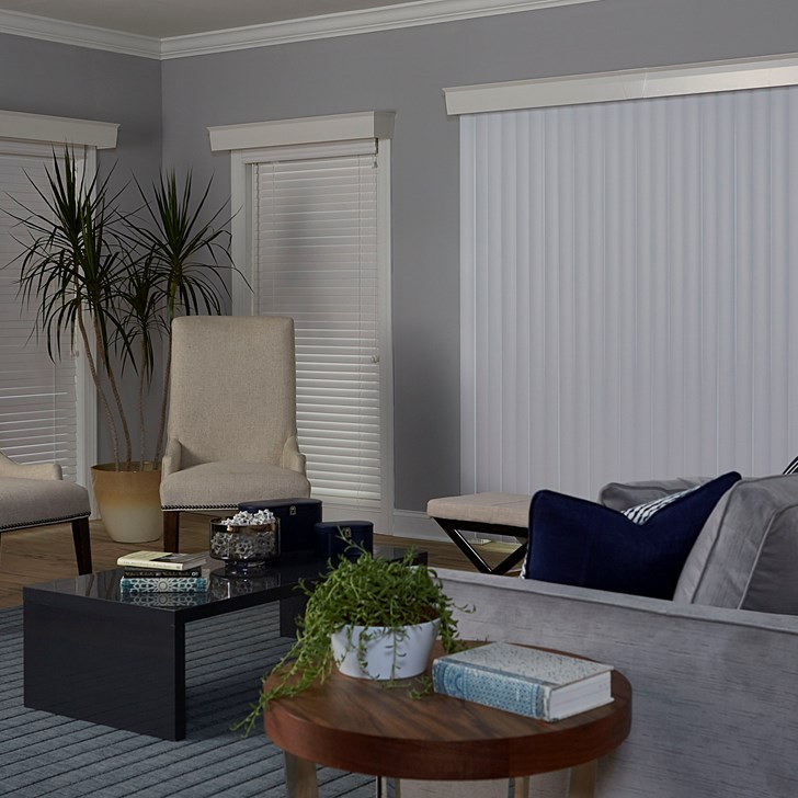 Vinyl Vertical Blinds in the Basic Smooth White color, 2 Inch Wood Blinds in the White color, and the Wood Cornice in the Davenport Cotton color.