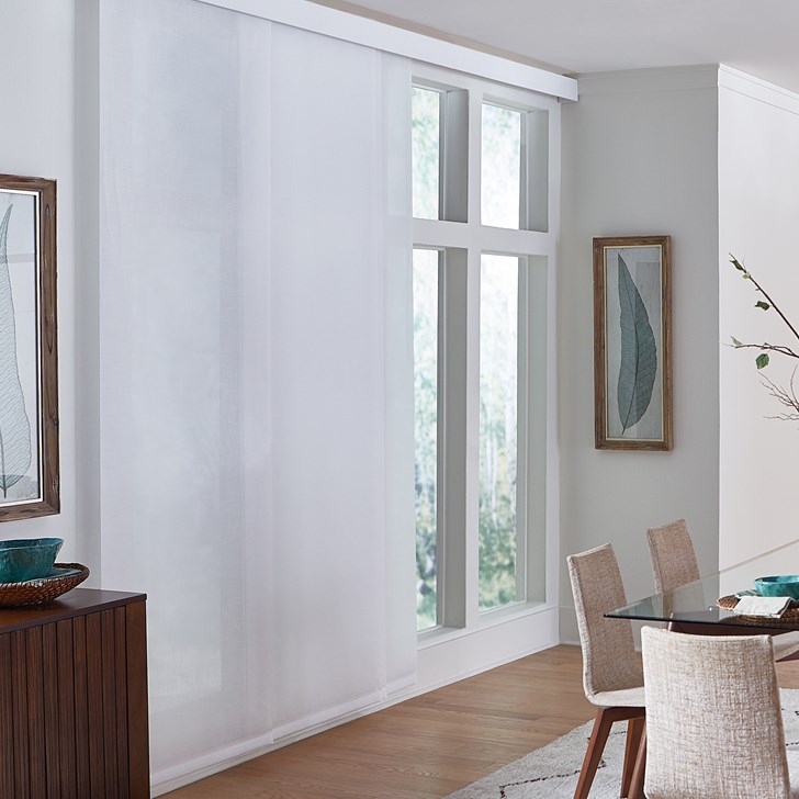 Fabric panels are a sleek choice for covering floor-to-ceiling, transom windows. Color: Flaxen 11% Pure White