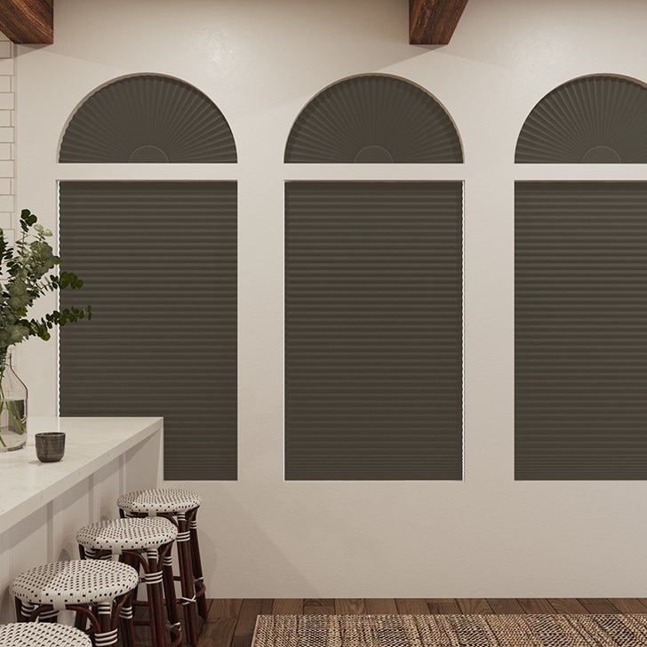 Blackout Cellular Arch and Blackout Cellular Shades in the Dark Chocolate color.