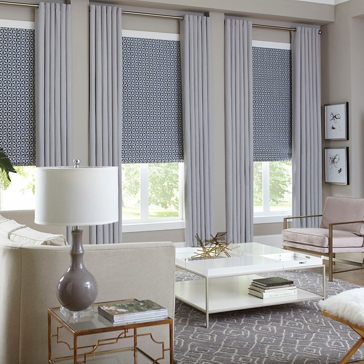 The Premier Roman Shades paired with the easy grommet drapery. Roman Shade Color: Twirl China Blue FB15090A & Drapery Color: Gent Greystone 1031