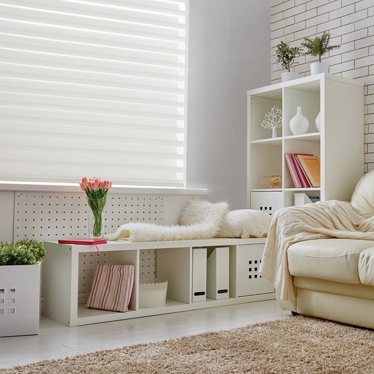 Lifestyle transitional living room scene featuring the Motorized Veneta Sheer Shade in the Snowflake color.