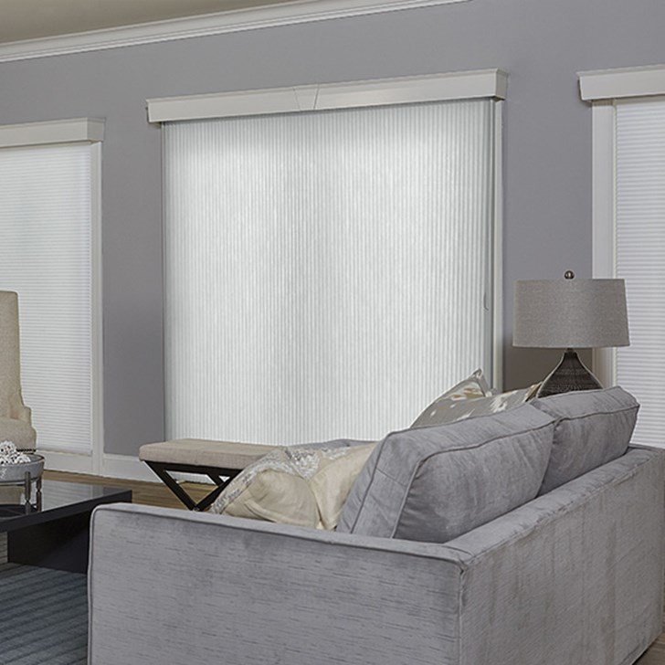 Vertical cellular shade paired with the signature cellular shade. Shade Color: White DLF812; Cornice: Davenport Cotton