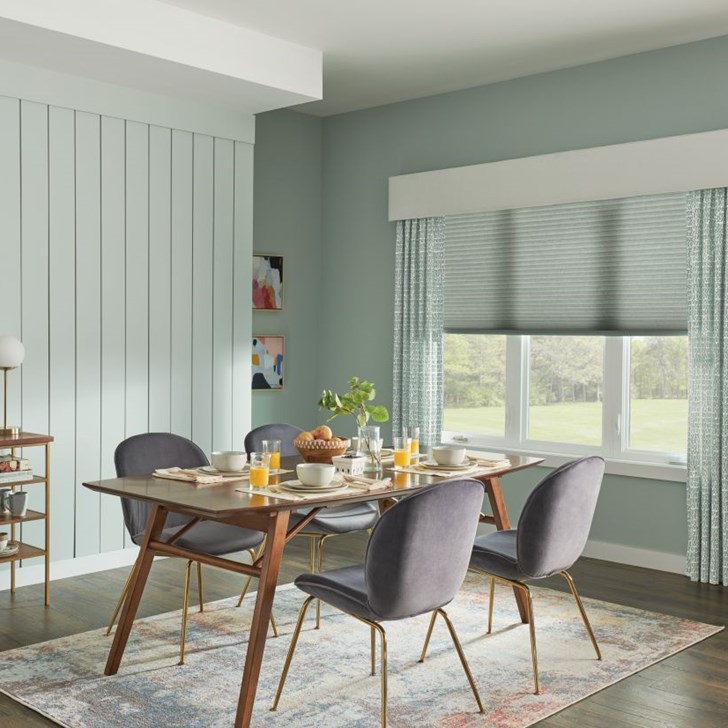 Drapes shown in color Cursive Wispy Sage 1253 and featuring Fabric Cornice.